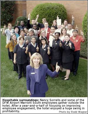 PHOTO: Hospitable surroundings: Nancy Sorrells and some of the DFW Airport Marriott South employees gather outside the hotel. After a year-and-a-half of focusing on improving employee engagement, the hotel enjoyed a huge swing in profitability.